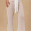 Spodnie z wiązaniem z przodu i szerokimi nogawkami Hydra w kolorze białym Spodnie z wiązaniem z przodu i szerokimi nogawkami Hydra w kolorze białym