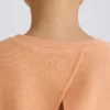 Teksturowana bawełniana bluza z odkrytymi plecami w kolorze brzoskwiniowym Teksturowana bawełniana bluza z odkrytymi plecami w kolorze brzoskwiniowym