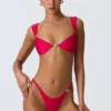 Top bikini Coquina z ozdobami w kolorze malinowo-różowym