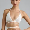 Top bikini Liberty z ozdobnymi krzyżującymi się ramiączkami w kolorze kości słoniowej Top bikini Liberty z ozdobnymi krzyżującymi się ramiączkami w kolorze kości słoniowej