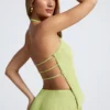 Top Elania z odkrytymi plecami i asymetrycznym dekoltem typu halter w kolorze oliwkowym Top Elania z odkrytymi plecami i asymetrycznym dekoltem typu halter w kolorze oliwkowym